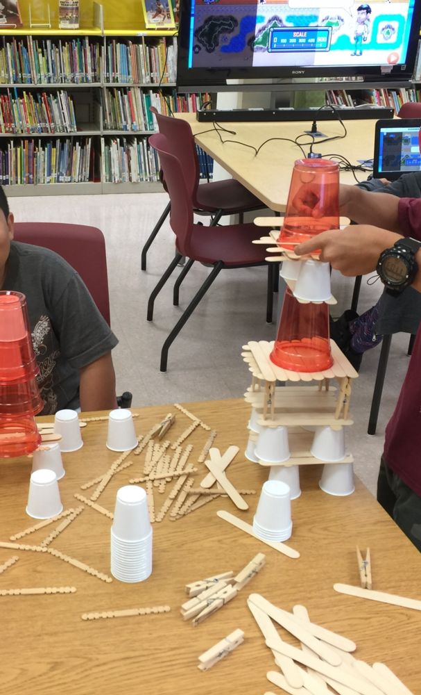 Students building with cups