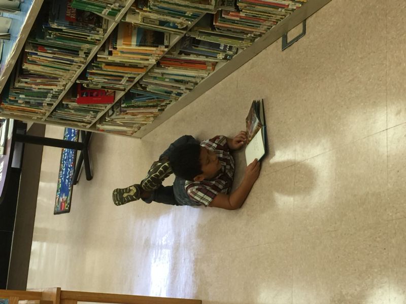 Child reading on floor